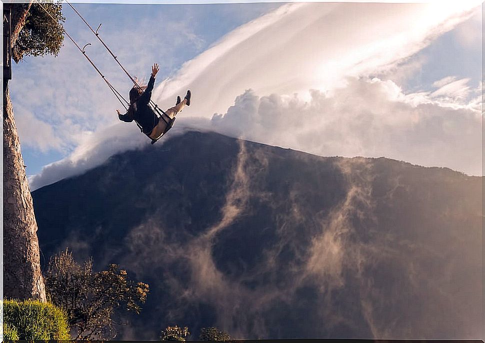 Woman on the swing at the end of the world